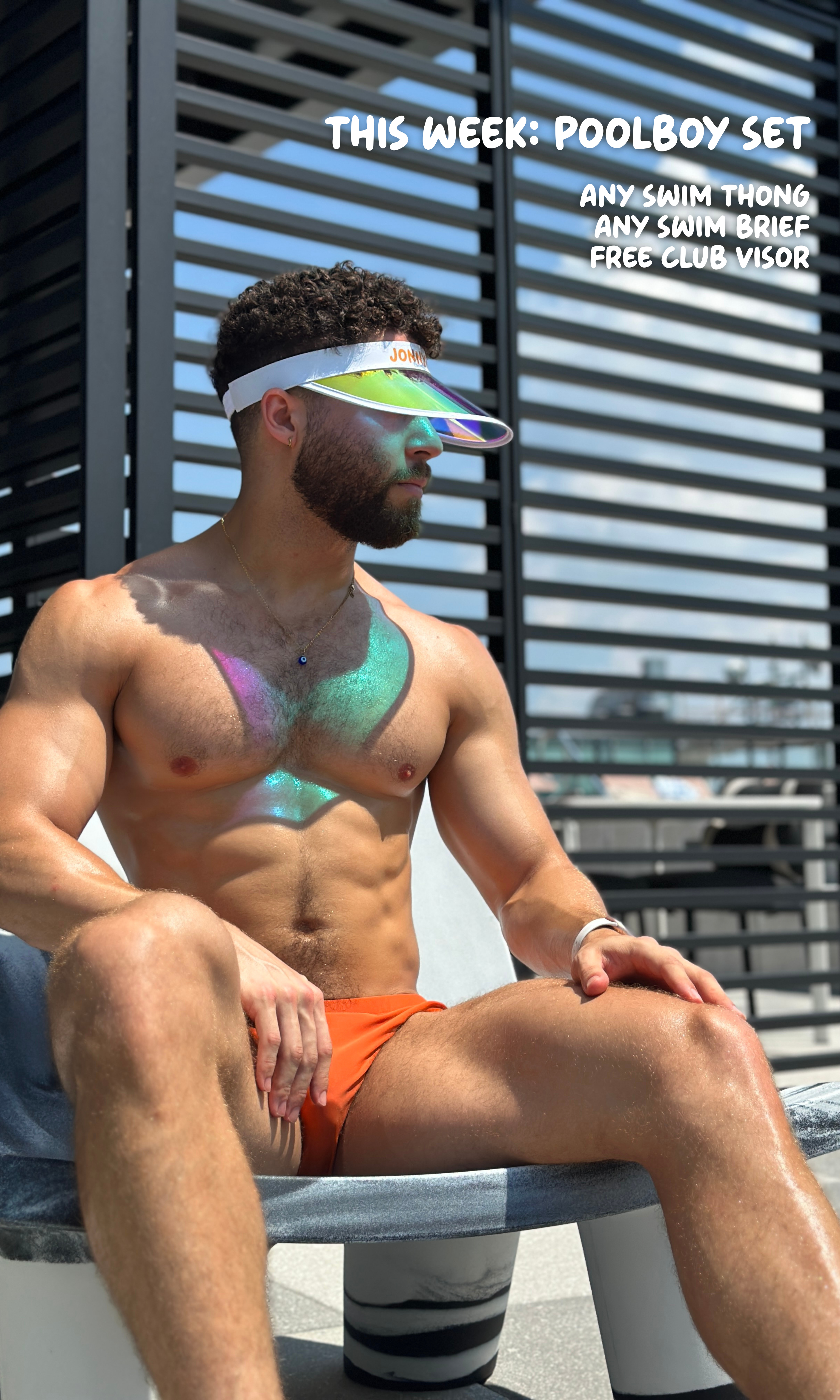 Man wearing a colorful swimsuit and visor sitting on a chair with text overlay.