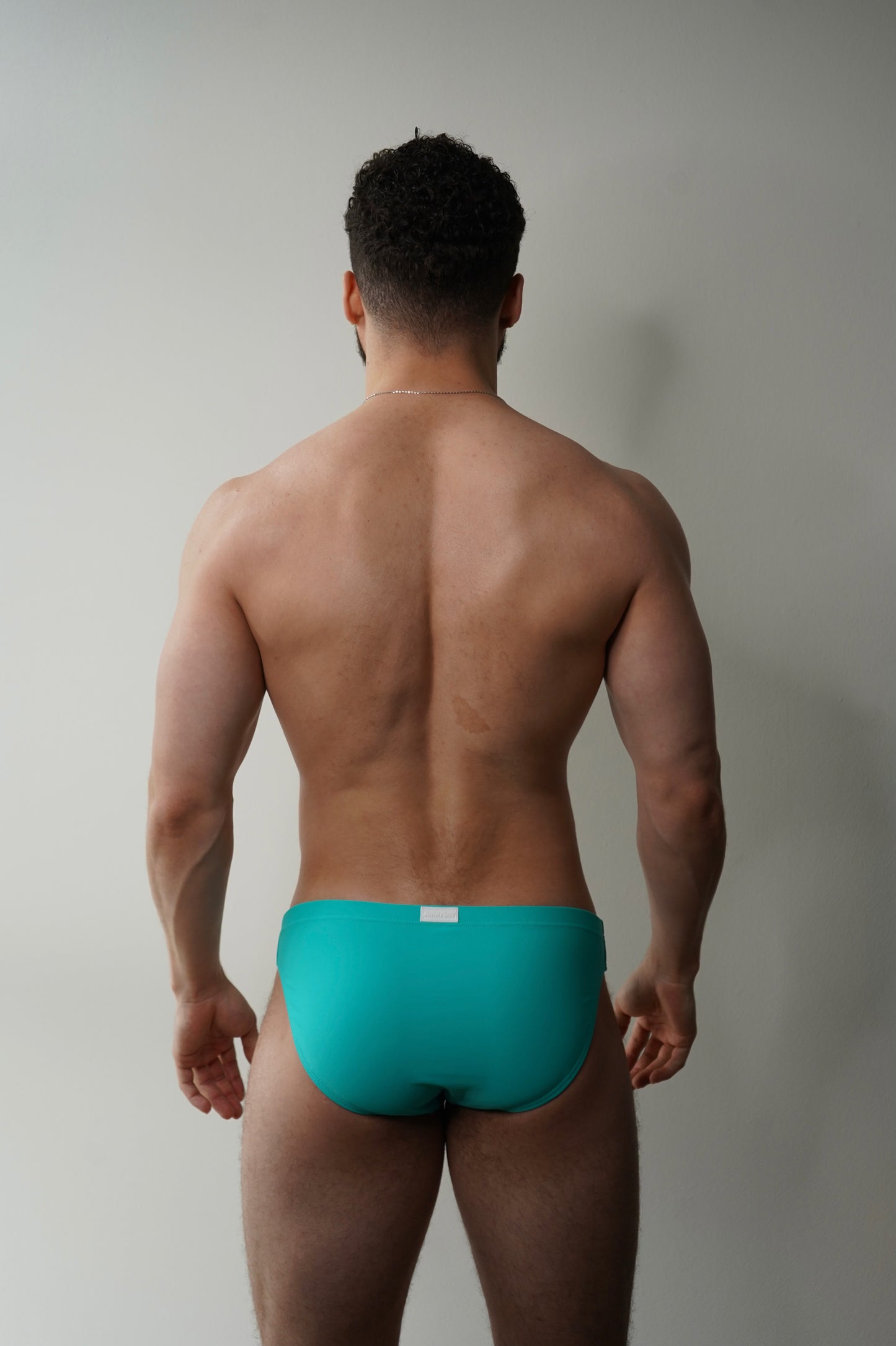 swim brief in turquoise